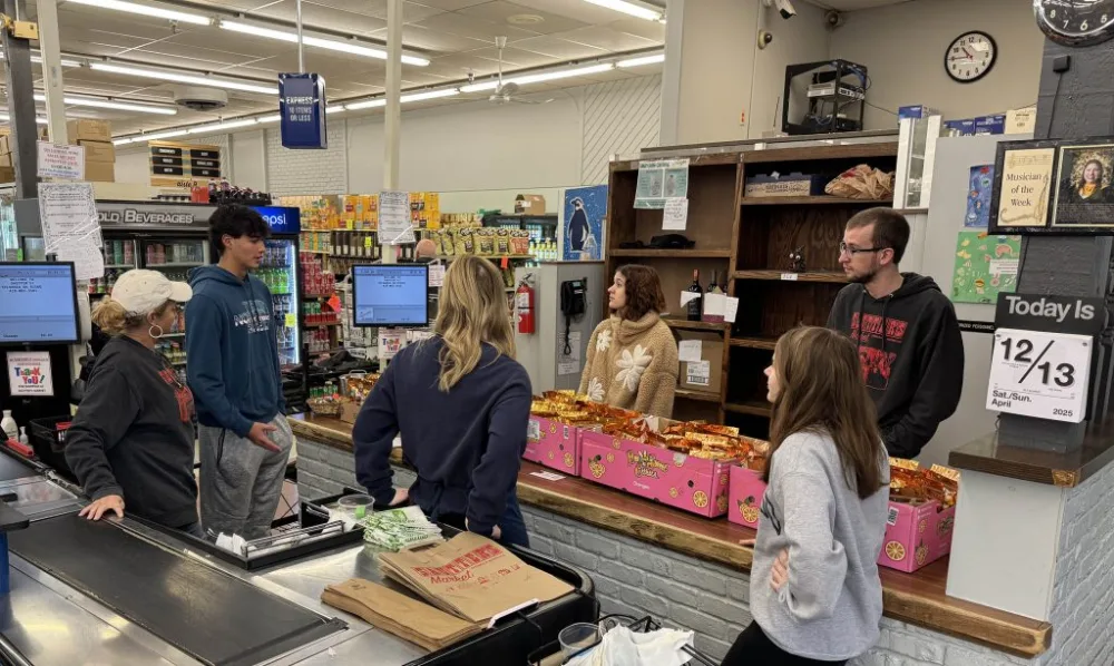 Avi training Sautter's staff on freeze-dried candy